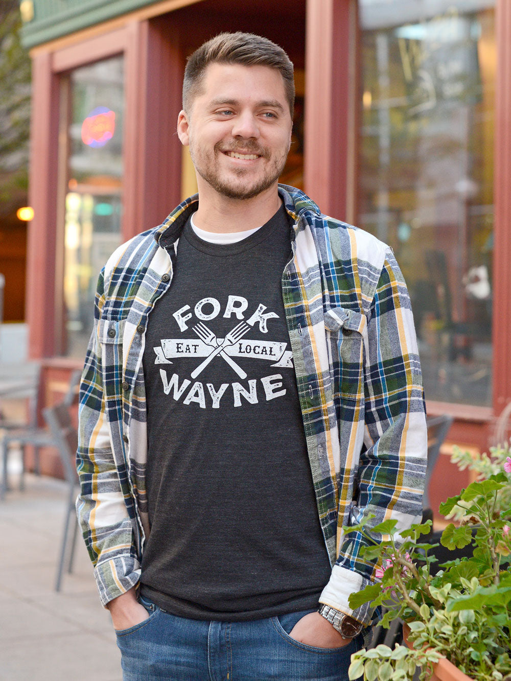 Fork Wayne Eat Local t-shirt on model outside pizza place