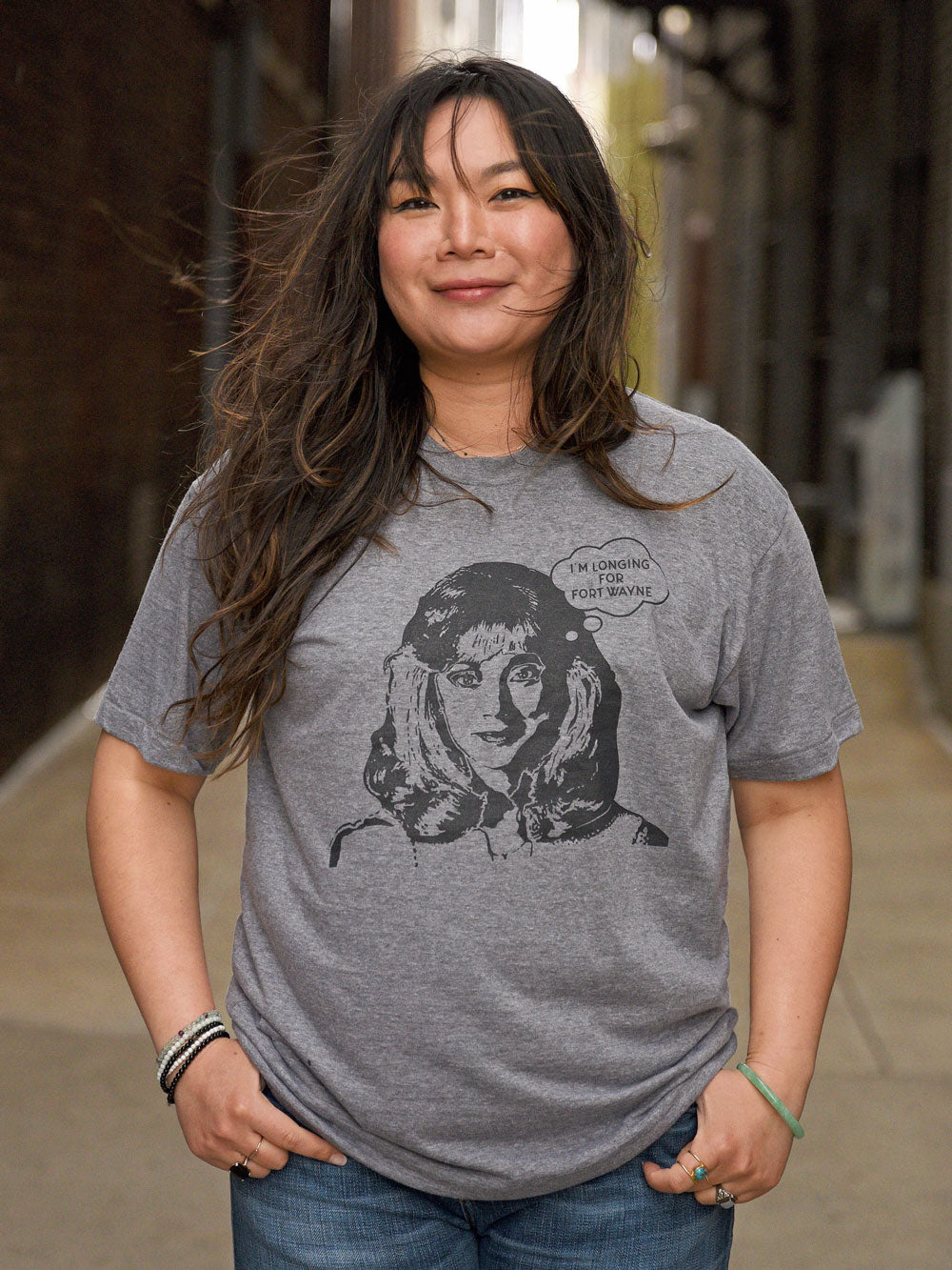 I'm Longing for Fort Wayne (Shelley Long) gray heather t-shirt on model in alley