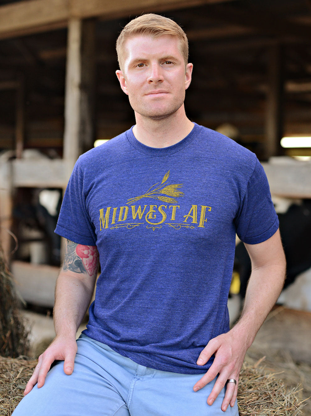 Midwest AF indigo heather t-shirt on model in front of cows