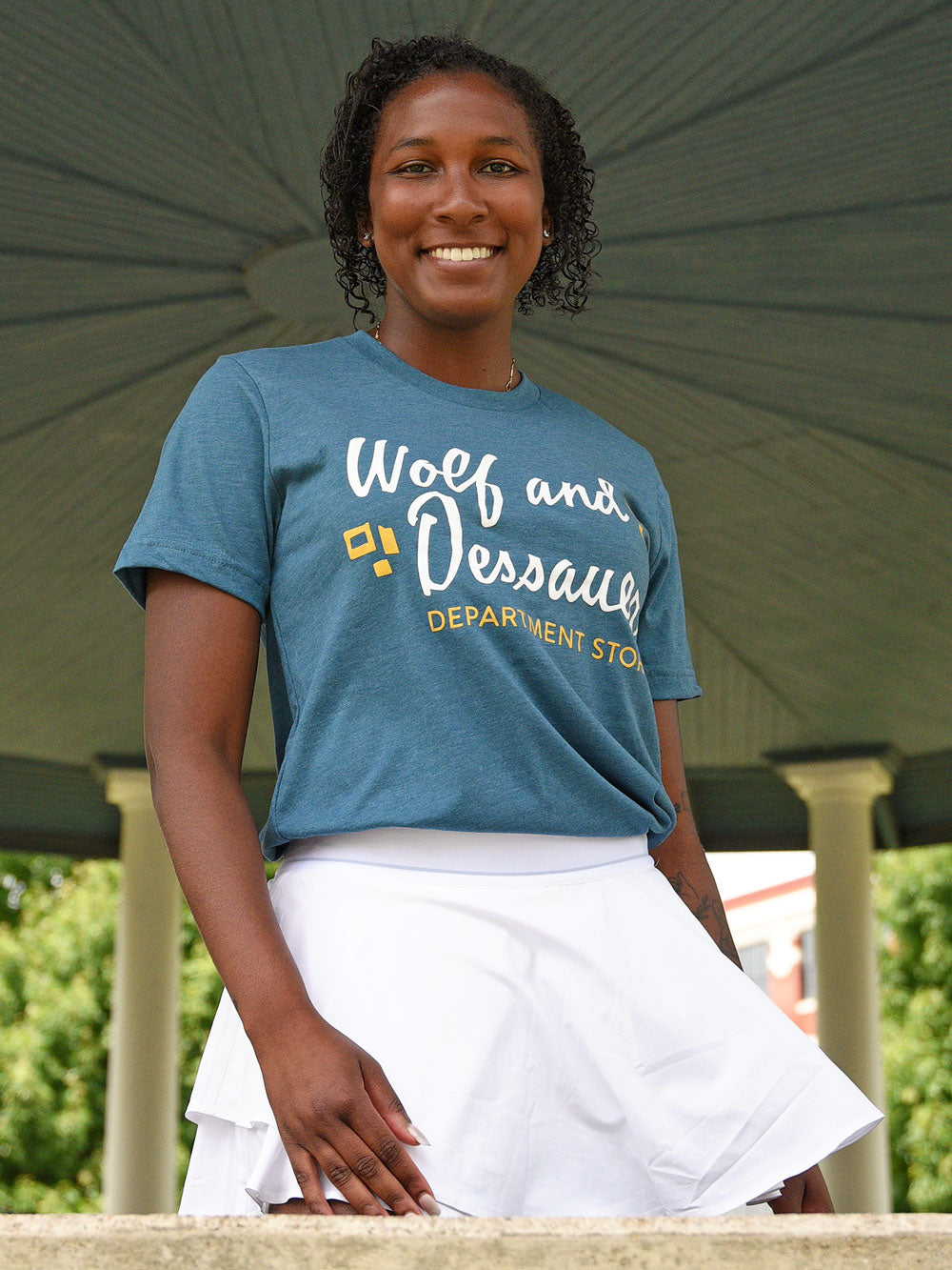 Wolf and Dessauer Department Store teal heather t-shirt on model in bandstand