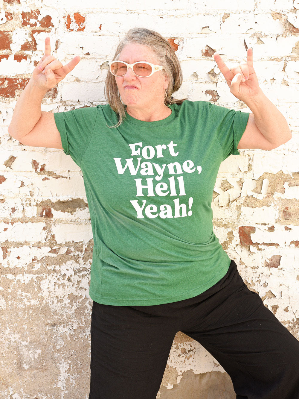 Fort Wayne, Hell Yeah grass green heather t-shirt on model with white sunglasses
