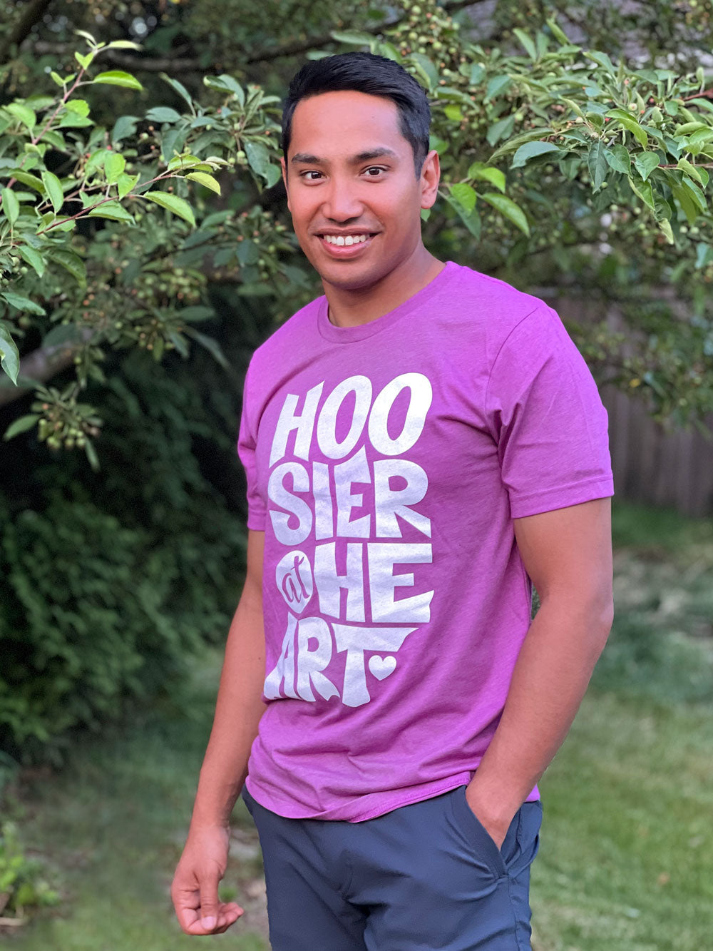 Hoosier at Heart magenta t-shirt on model by green tree