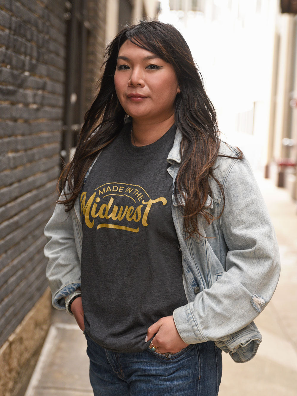 Made in the Midwest black heather t-shirt on model in alley
