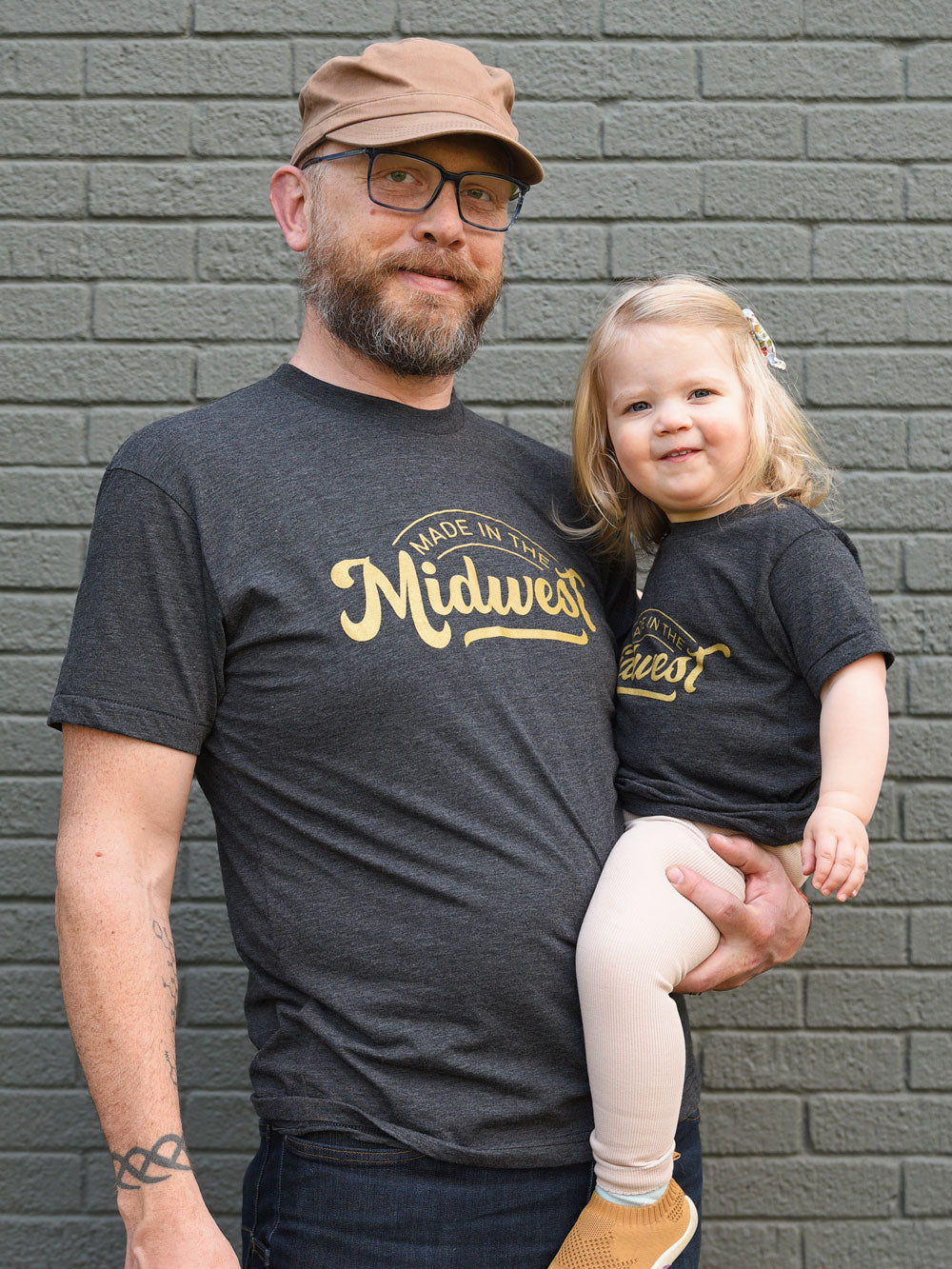 Made in the Midwest black heather t-shirt on dad and daughter