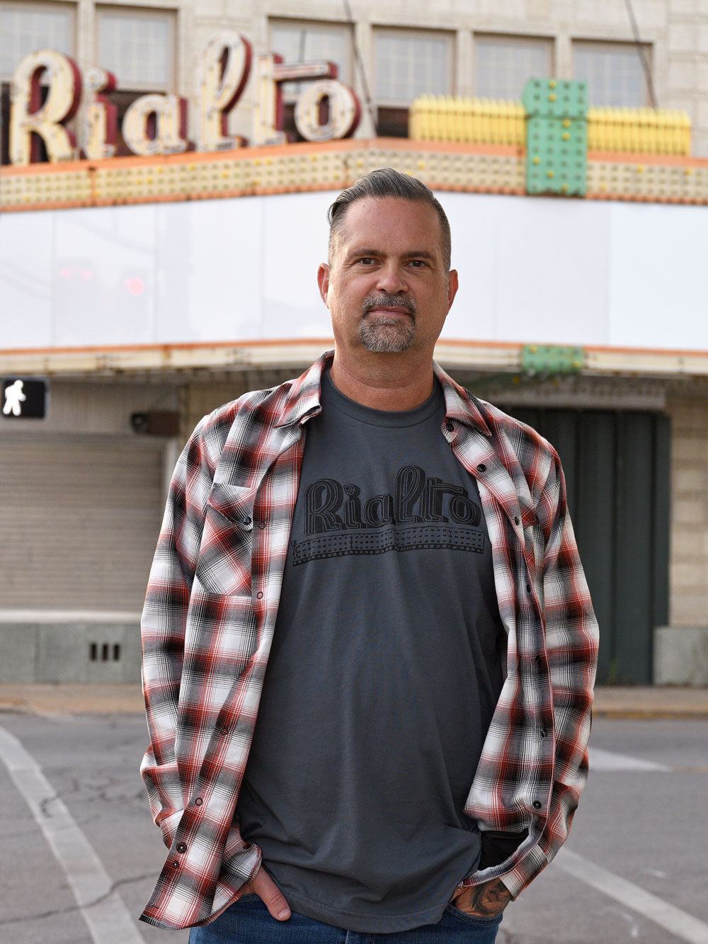 Rialto gray t-shirt on model in front of Rialto Theater