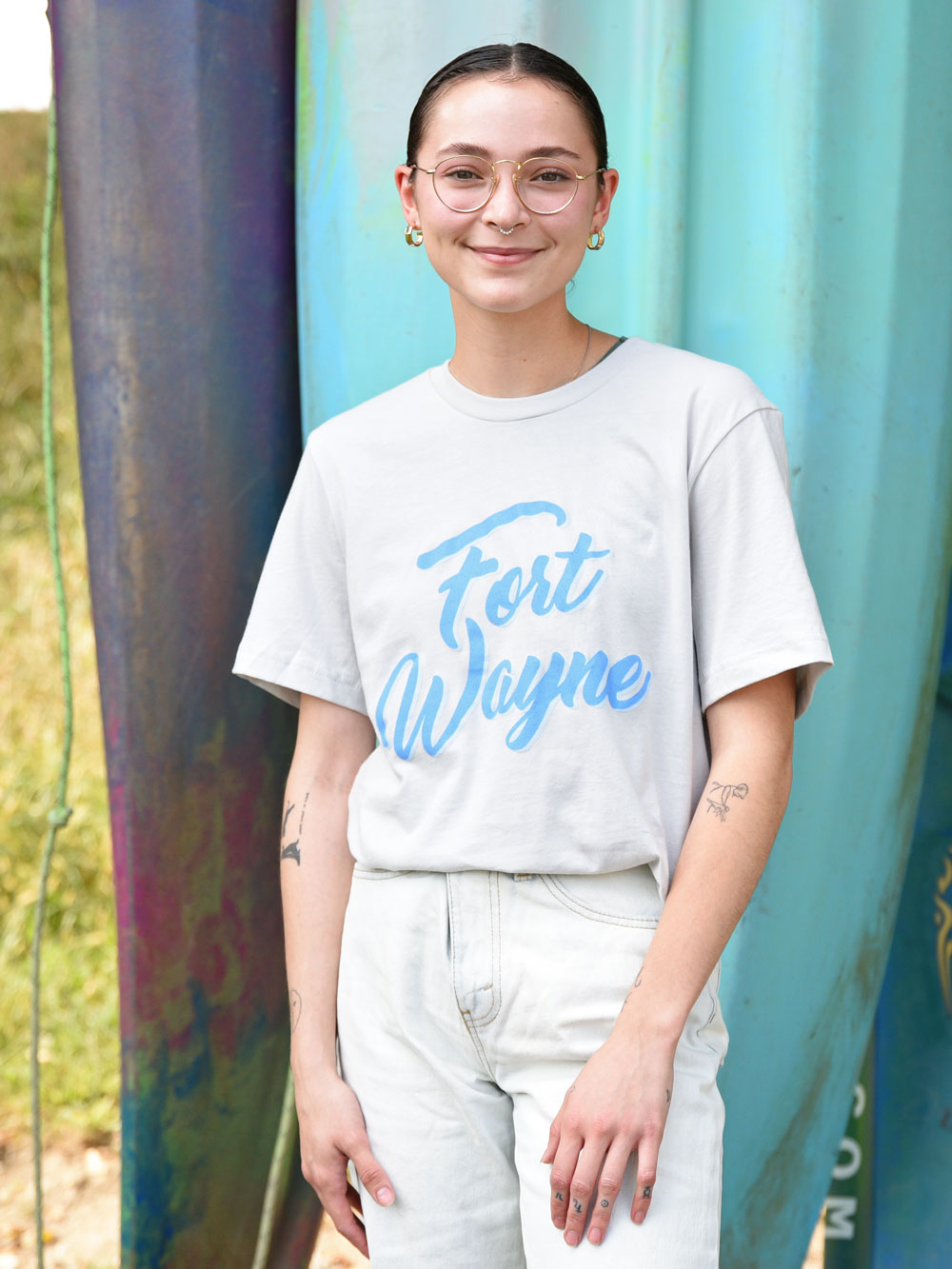 Blue ink Script Fort Wayne t-shirt on model by colorful kayaks