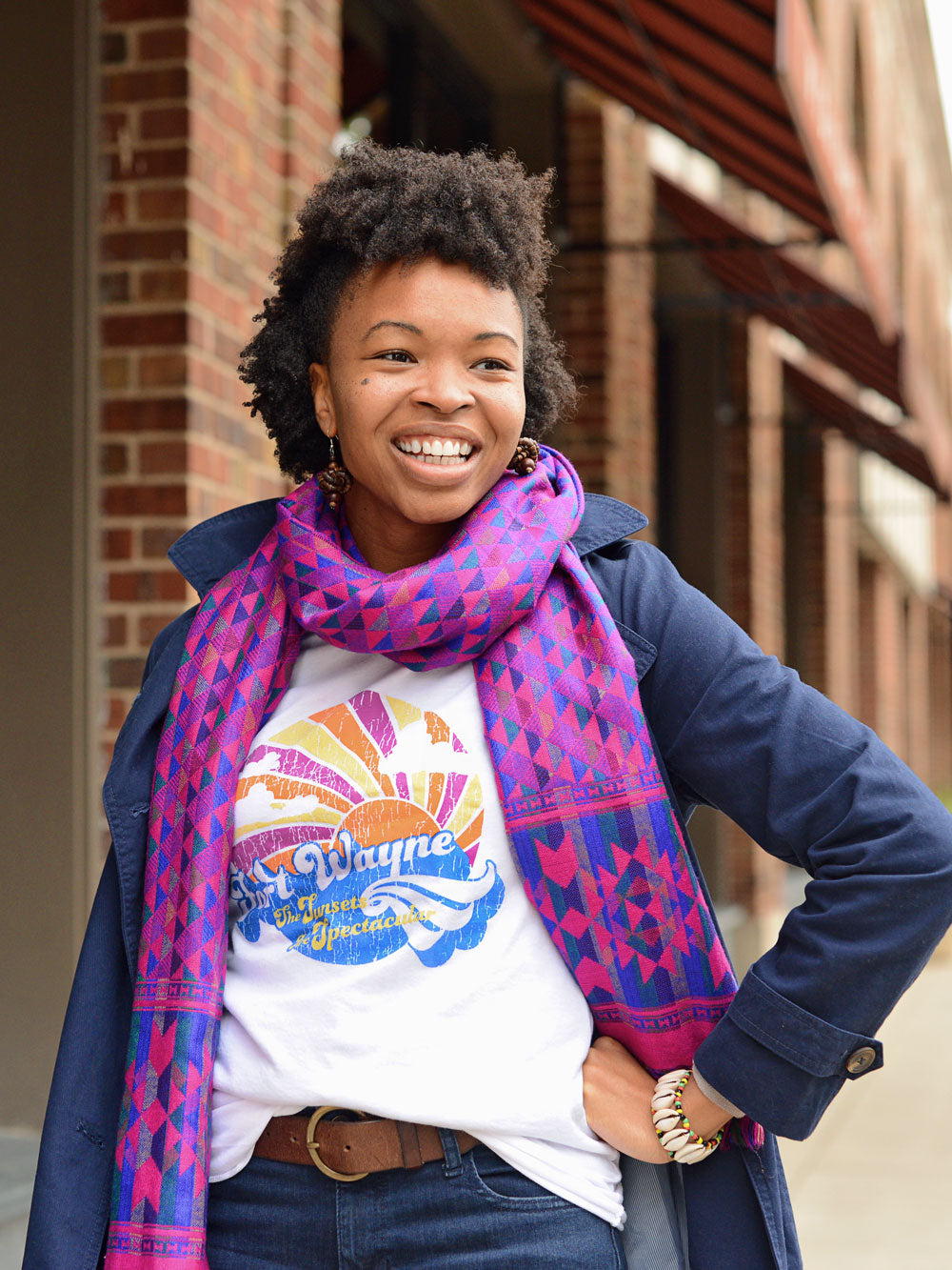 Fort Wayne the Sunsets are Spectacular baseball tee on model with purple scarf